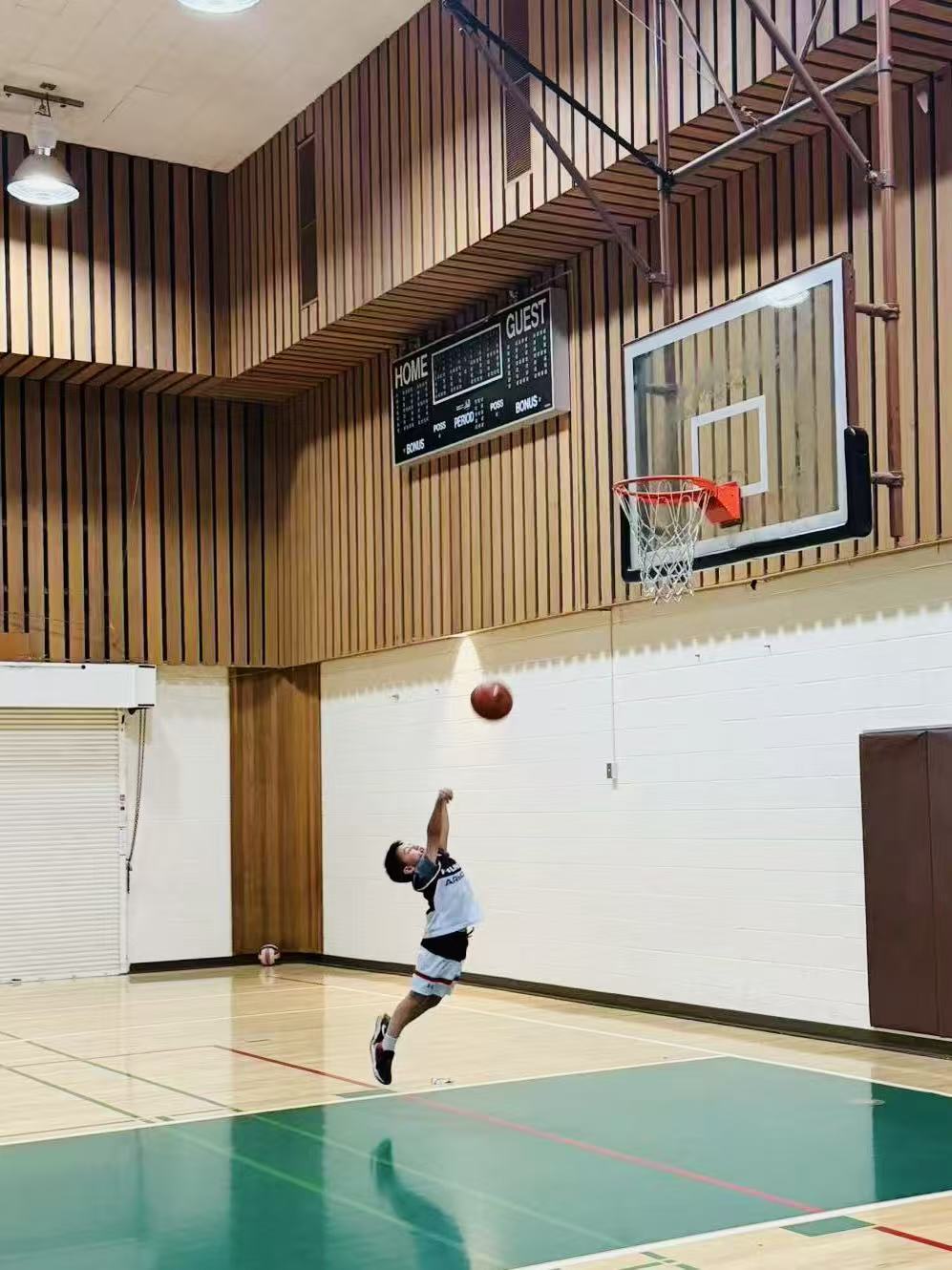Eddie going up for a shot on the basketball court