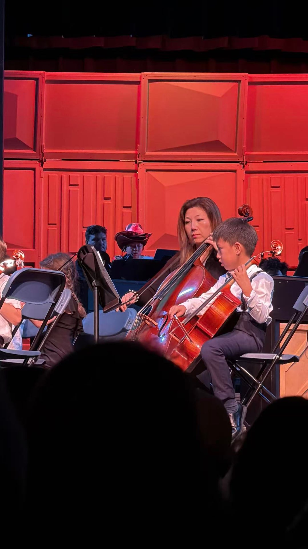 Eddie performing cello on stage
