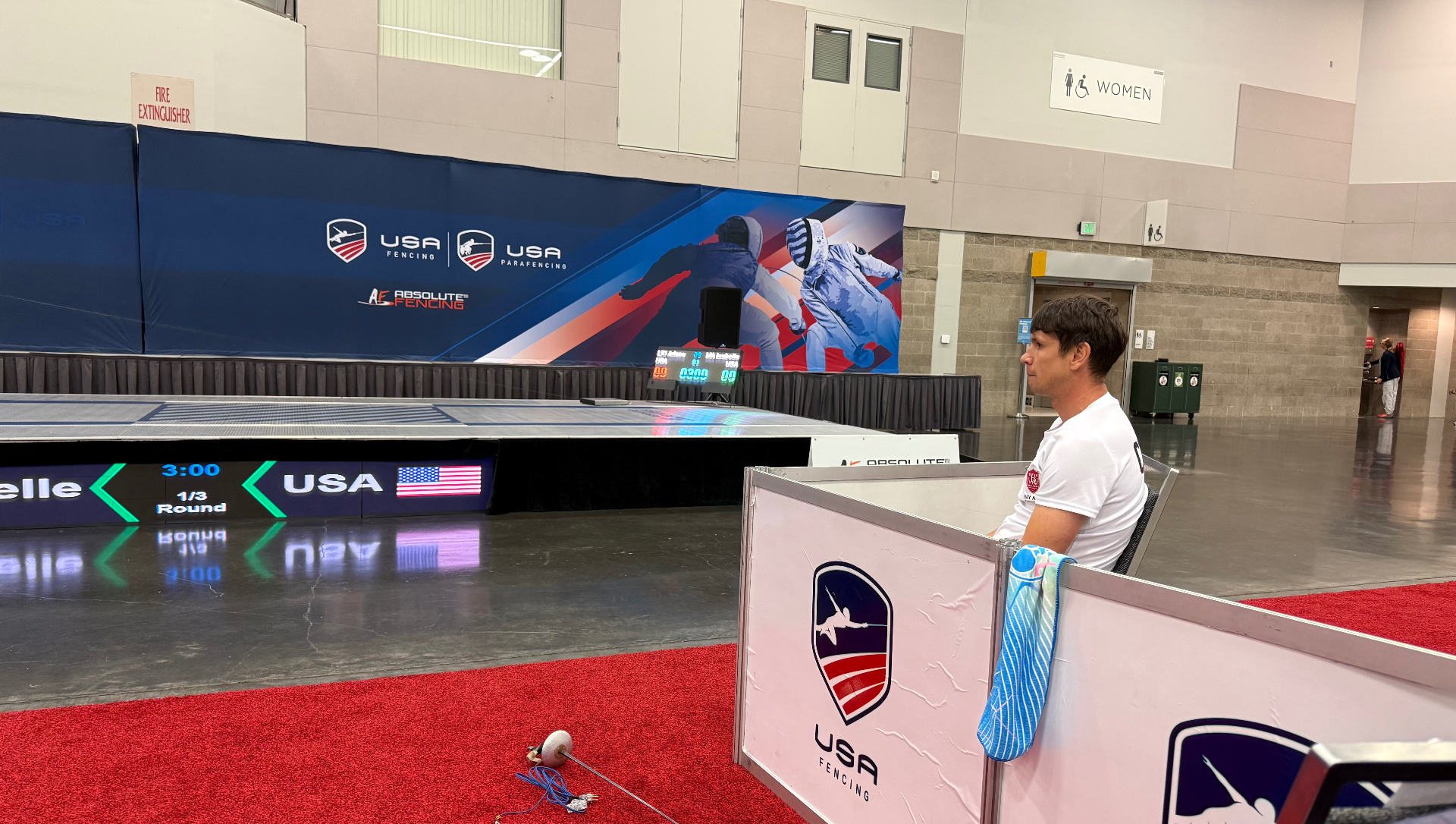 Coach Vakhob watching a bout at USA Fencing tournament